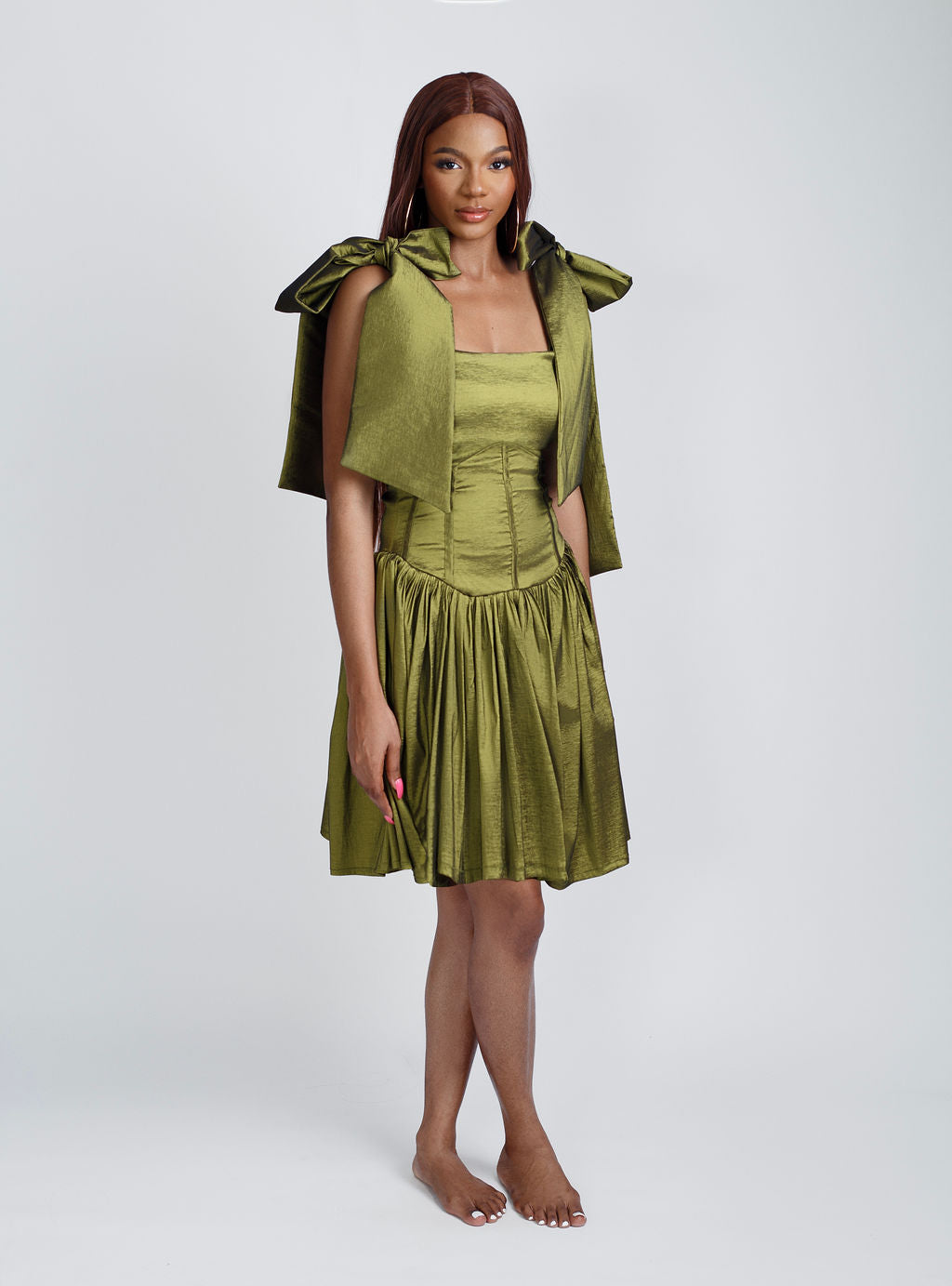 Fashion-forward green mini bow-strap dress with elegant shoulder bows and a playful above-the-knee fit. Perfect for summer parties, brunch dates, and special occasions. Shop trendy women’s dresses, chic summer outfits, and 2025 fashion must-haves at Kaiiko and Virgo.