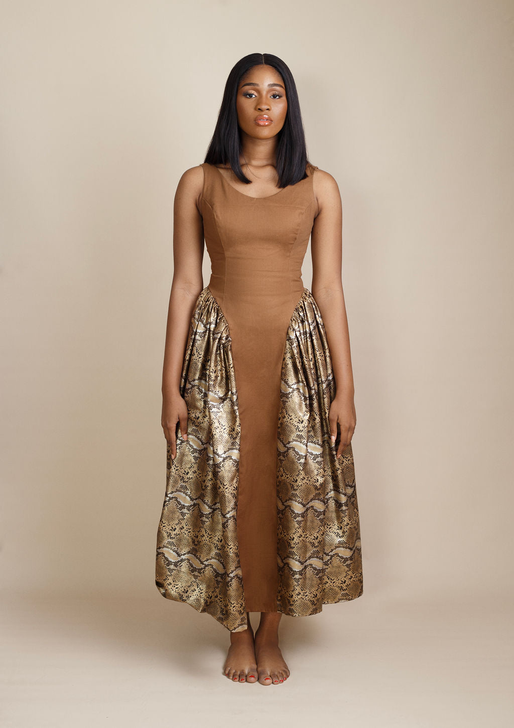 Bold and stylish snake print and brown dress, blending exotic patterns with earthy tones for a fierce, fashion-forward look. Perfect for making a statement at parties, night outs, or upscale events. Shop trendy and bold women’s fashion now at Kaiiko and Virgo