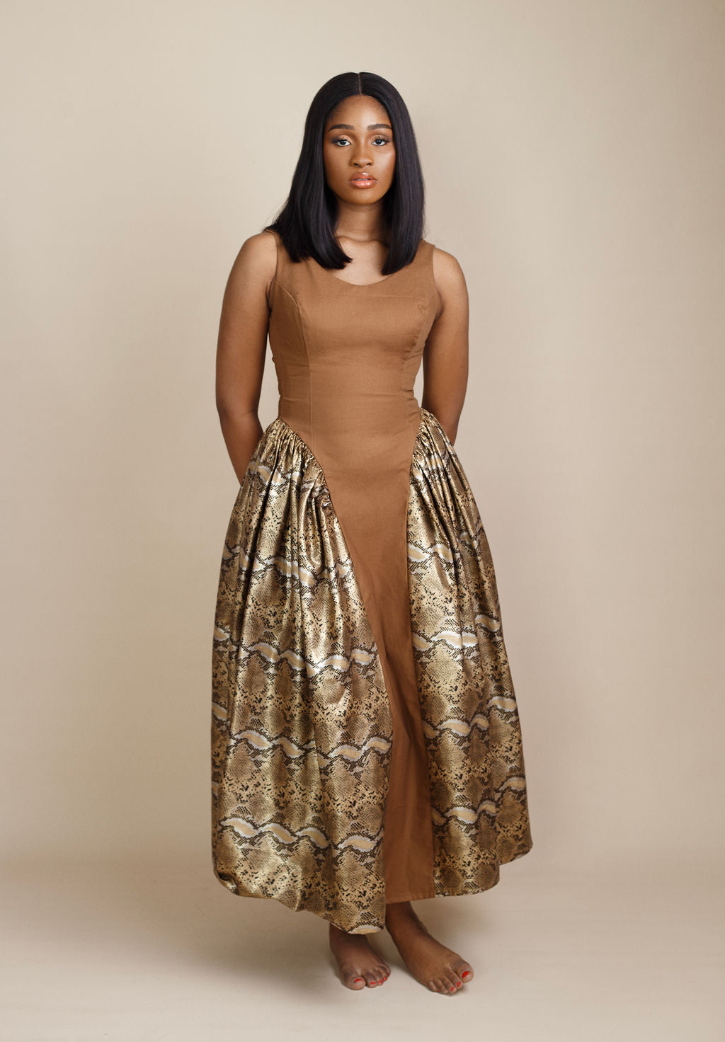 Chic snake print and brown flowy dress, blending exotic animal patterns with rich earthy tones for a bold and sophisticated 2025 fashion statement. Perfect for upscale events, casual outings, and trendsetting looks. Shop luxury women's dresses and trending 2025 styles now at Kaiiko and Virgo.