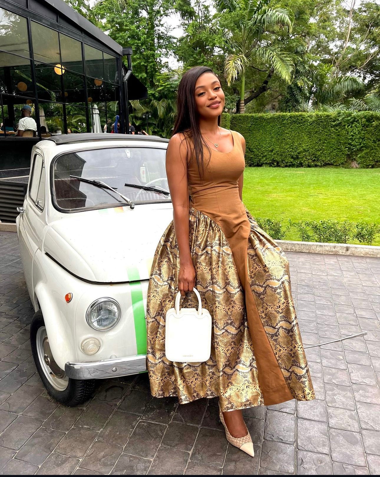 Elegant snake print and brown maxi dress, featuring bold animal patterns and earthy tones for a chic, on-trend 2025 fashion statement. Perfect for fashion-forward women attending parties, brunches, or upscale events. Shop the latest luxury women's dresses and trending fashion styles at Kaiiko and Virgo.