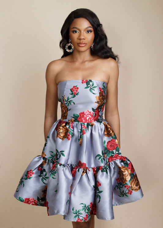 Chic grey strapless floral dress with vibrant red flowers, designed with a flattering flare above the knee. Perfect for weddings, special occasions, and elegant events. Shop trendy occasion dresses and stylish women’s fashion for 2025 at Kaiiko and Virgo.